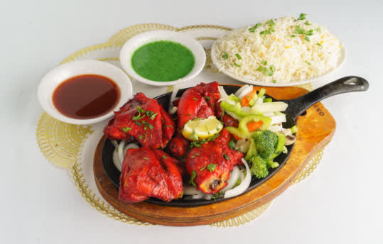 Tandoori chicken from the tandoor, prepared for catering